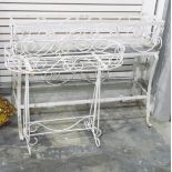 White painted metal rectangular plant stand of spiral design,