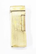 9ct gold Dunhill lighter of engine turned rectangular form