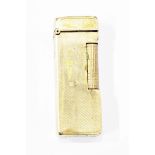 9ct gold Dunhill lighter of engine turned rectangular form