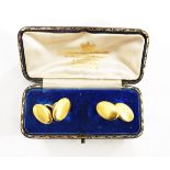 Pair of late 19th/early 20th century gold cufflinks of plain oval form,