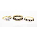 Gold three-stone diamond crossover ring marked 18ct,