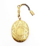 Gold-coloured metal double-opening locket with engraved decoration, possibly high carat,