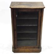 Victorian walnut veneer music cabinet, the glazed panel door enclosing four shelves,