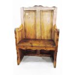 Old pine panel-back seat with downswept arms and solid seat,