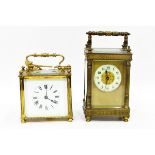 Carriage clock in ornate brass case, with bevelled glass panels,