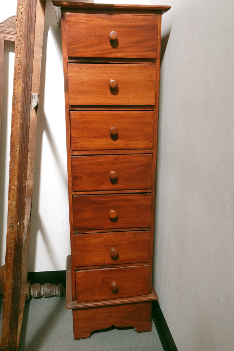 Stained hardwood narrow chest of seven drawers