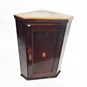 19th century oak corner cupboard, the panel door with shell inlay, enclosing two shelves,