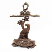 Cast iron umbrella stand, with two divisions of naturalistic design,