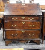 Georgian oak bureau, the fall-front enclosing a fitted interior of small drawers and pigeonholes,