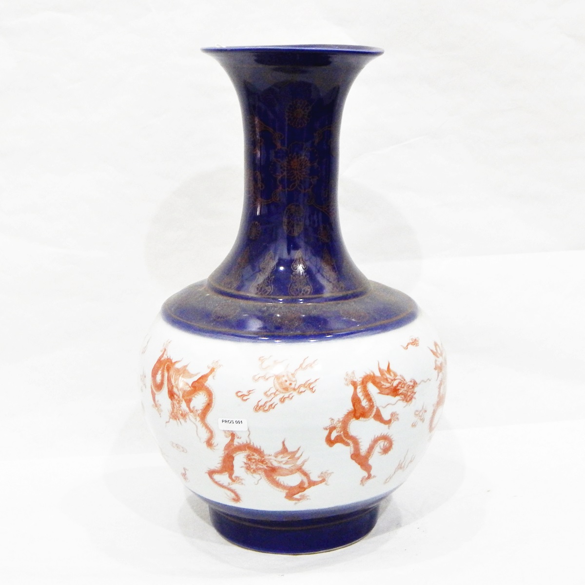 Porcelain vase of ball and shaft shape with flared rim,