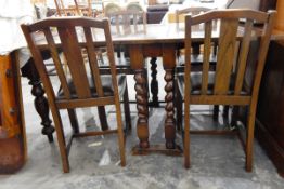 Oak finish fall-flap gateleg dining table with spiral turned standards and a set of four oak-framed