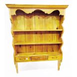 Pine open shelf plate-rack with three frieze drawers,