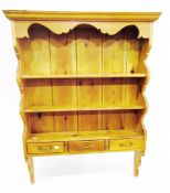 Pine open shelf plate-rack with three frieze drawers,