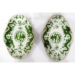 Pair of 19th century dishes of lobed oval form, decorated with dragons in green enamel,