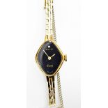 Avia lady's gold plated evening watch with black dial set with a diamond and a link bracelet