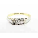 Gold three-stone diamond ring,