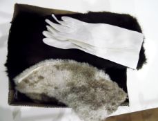 Three pairs of white kid gloves, various fur tippets and a cossack-style fur hat, etc.