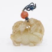 19th century Chinese carved jade model of a qilin with a boy on its back,