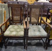 Pair of circa 1920's oak framed carver elbow chairs having guiloche carved crest rail,