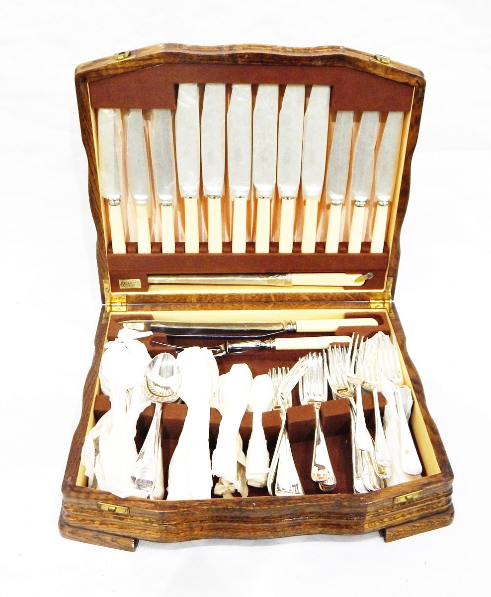 Canteen of silver plated flatware by Walker and Hall in fitted oak case