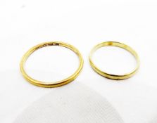 Two gold wedding bands, one unmarked, one indistinctly marked, approx.