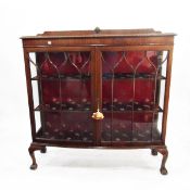 Chippendale style mahogany bow front glazed display cabinet, with gadrooned bordered top,