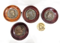 Set of four moulded brass plaques of profile portraits of gentleman, possibly Shakespeare,