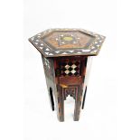 Camel-style stool with leather cushion and an Eastern mother-of-pearl inlaid table of hexagonal