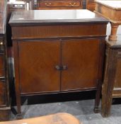 Columbia gramophone within a mahogany cabinet, the pair of panelled doors enclosing sound box,