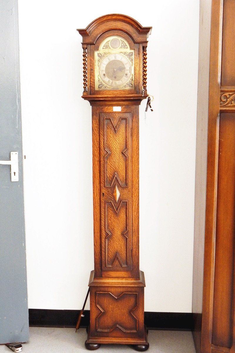 Grandmother clock with arched brass dial, the movement striking with Westminster chimes,