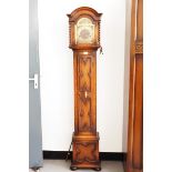 Grandmother clock with arched brass dial, the movement striking with Westminster chimes,