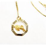 9ct gold Taurus pendant depicting a charging bull, on 9ct gold box-link chain, approx.