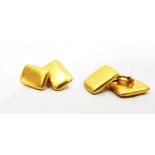 Pair of gold cufflinks of rectangular form with a bloomed matt finish, with chain links,