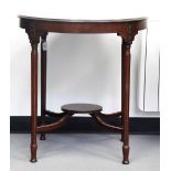 Edwardian circular mahogany centre/occasional table raised on tapering fluted legs,