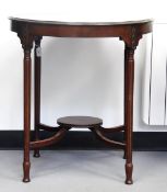 Edwardian circular mahogany centre/occasional table raised on tapering fluted legs,