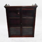 Glazed mahogany bookcase, pair of panelled doors enclosing shelves,