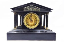 Victorian slate mantel clock, of temple design supported by columns,