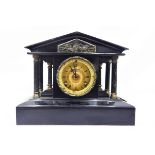 Victorian slate mantel clock, of temple design supported by columns,