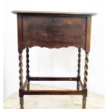 Edwardian stripped walnut shaped-rectangular occasional table and a circa 1930's oak workbox on