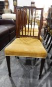 Set of four mahogany framed Hepplewhite-style dining chairs on square tapering supports and spade