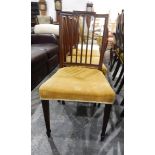 Set of four mahogany framed Hepplewhite-style dining chairs on square tapering supports and spade