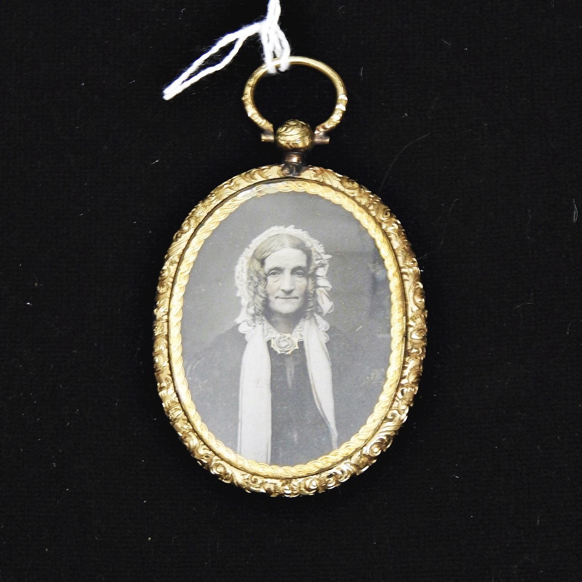 Victorian ornate pinchbeck/gold-plated glass locket with ambro-type portrait photograph