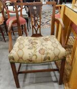 19th century mahogany elbow chair with fret carved splat back and stuffover seat