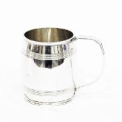 Silver mug by Harrison & Howson, Sheffield 1931, of plain barrel form with two reeded bands,