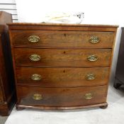 Early 19th century bowfront chest of four drawers with oval brass plates and drop handles,