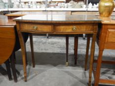 Georgian style walnut veneered bow front side table, with plate glass top, two frieze drawers,