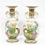 Pair of Japanese Meiji period porcelain vases, probably Kinkozan, each footed,