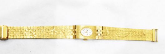 Imado lady's gold plated dress watch with oval silvered dial,