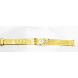 Imado lady's gold plated dress watch with oval silvered dial,