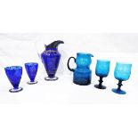 Blue glass water set comprising pedestal jug and set of four pedestal glasses,